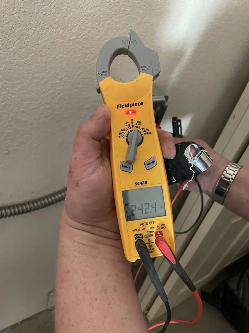 Voltage testing with clamp meter during Aluminum Wiring Replacement in Greeneville